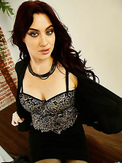 Pretty black-haired girl strips