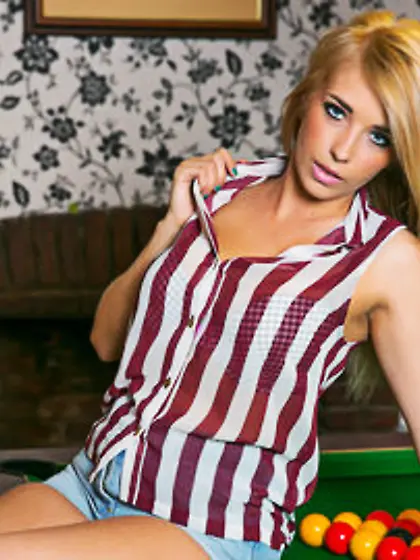 Blonde stunner gets on the pool table and strips naked for the c