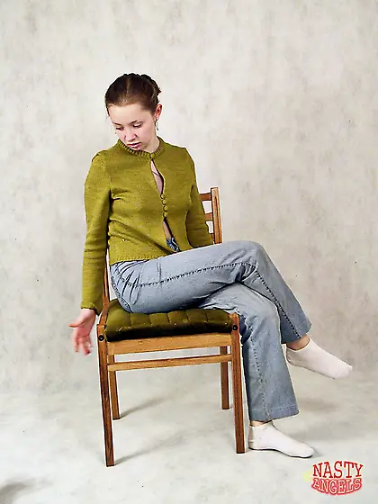 Shy babe performs a naked show on an old-fashioned stool in her