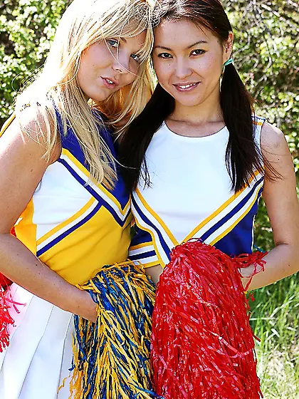Cute teenie cheerleaders toying