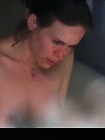 Golden blonde is covering her hard nipples