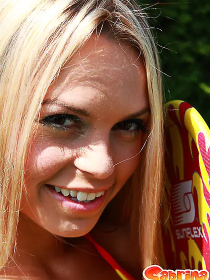 Hot blonde bimbo Sabrina Blond strips outdoors and shows her per