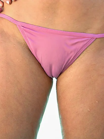 Beauty with light hair exposing her wonderful pussy by the pool