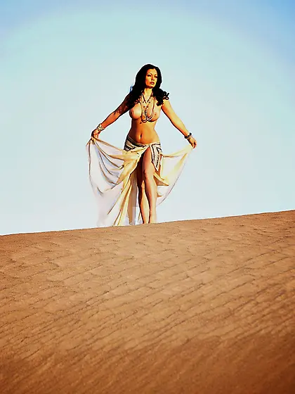 Hot Aria Giovanni performs a passionate striptease on a sunny da