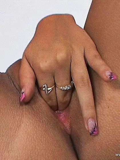 Krisztina Banks spreads her sexy legs for the camera and toys he