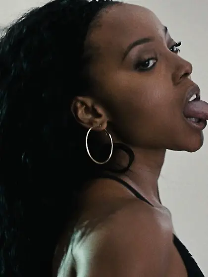 Ebony stripper slowly undresses in the bathroom