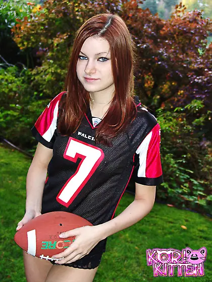 Cute redhead teen gal Kori Kitten takes off her shirt and shows