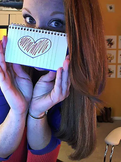 Salacious redhead Lucy OHara poses in opaque stockings and shows