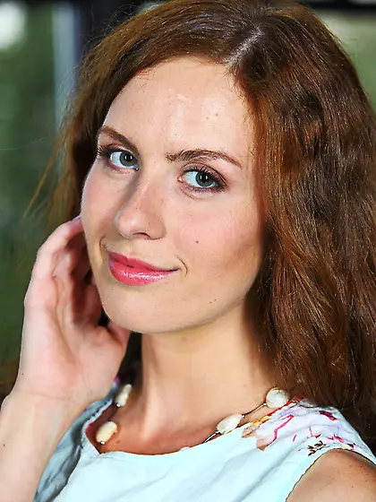 Pretty babe sits orange