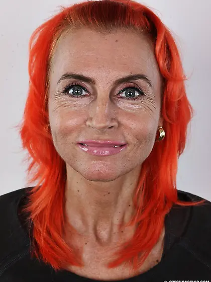 Dreamy orange-haired floozy displays