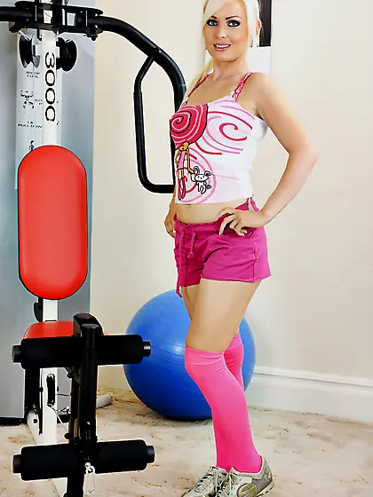 Beautiful blonde gal Alexis Jade strips her pink lingerie and ex