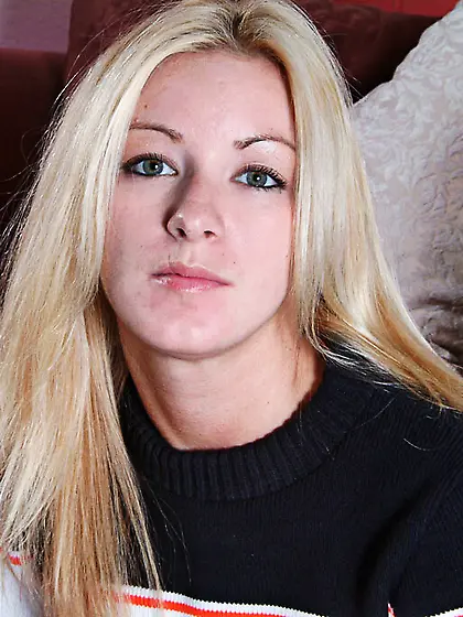 White-haired cheerleader Sarah Sinn gives a close-up of her pink