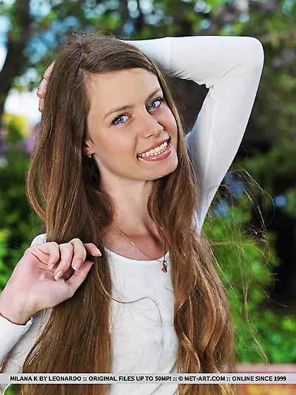 Long-haired college beauty striptease