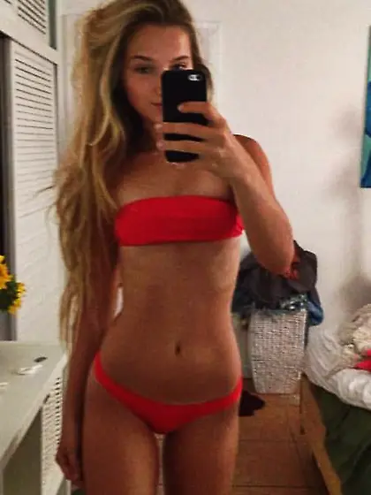 Playful young girlfriends are posing in bikinis