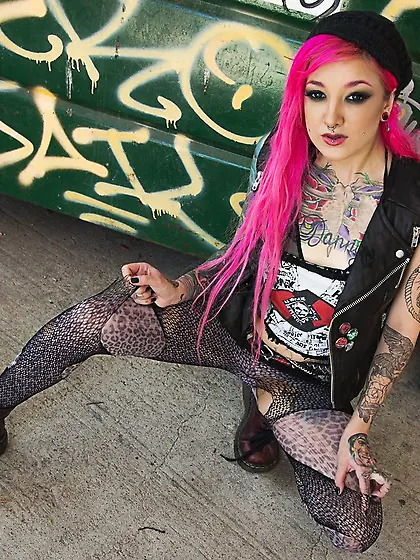 Kelsi Lynn shows off her petite ass and pussy beside the dumpste