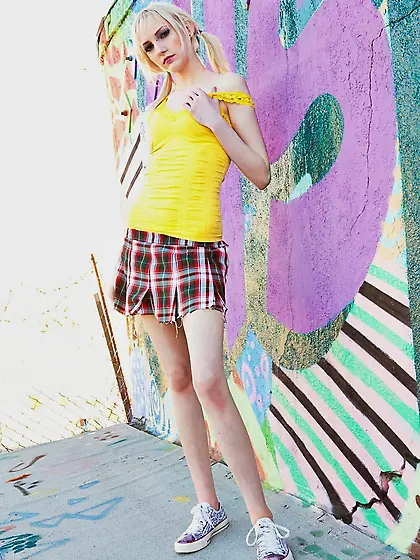 Lacey Lust strips and fingers her pussy for a hardcore photo sho