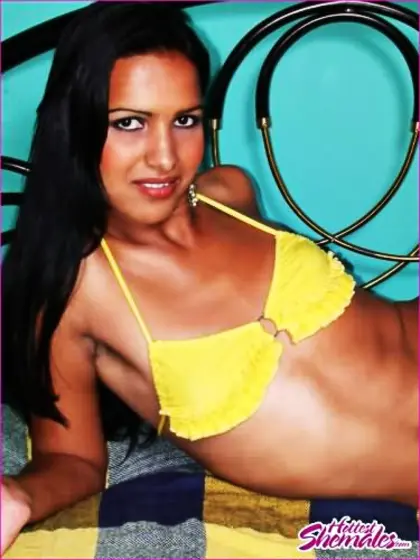 Beautiful Long Haired Tgirl Undressing In Bedroom