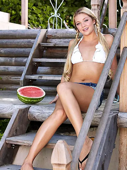 Shaved teen Jessie Andrews is eating the water-melon and beading