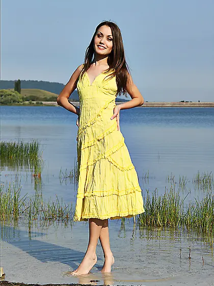 Gorgeous brunette girl Esther P poses on the lake without her ye