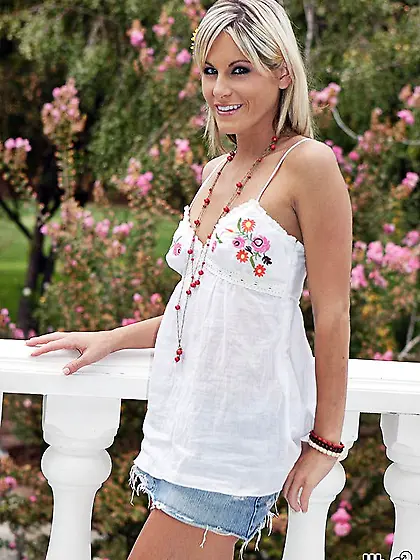 Lovely small-titted blonde Courtney Simpson strips and poses on