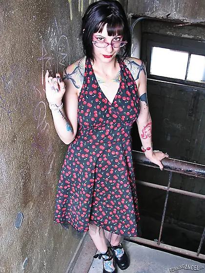 Female with glasses and piercing in clitoris demonstrates her na