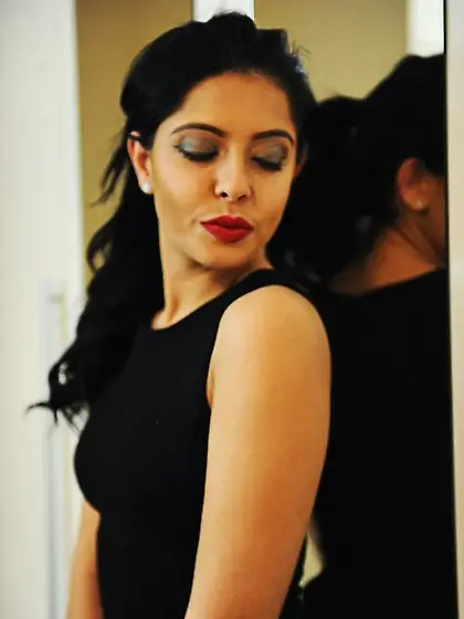 Glamorous brunette takes off black dress and red lingerie posing