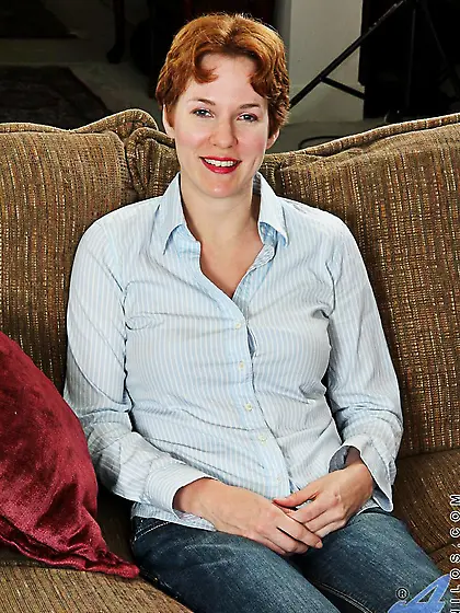 Redhead milf Gigi Anilos taking off jeans and furiously rubbing