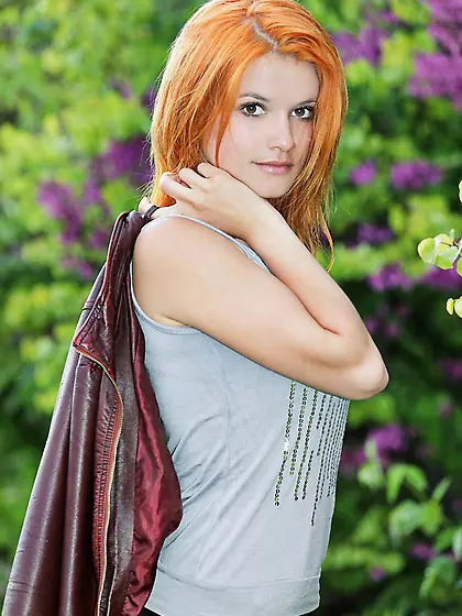 Nothing but the blossoming poppies are hiding the nude body of r