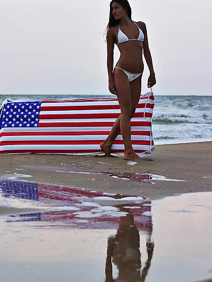 Sasha C takes her sexy white bikini on the beach and shows her p