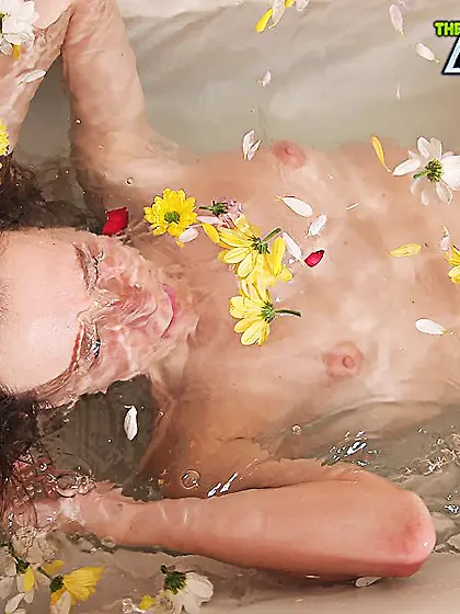 Babe plays with herself in bathtub of petals