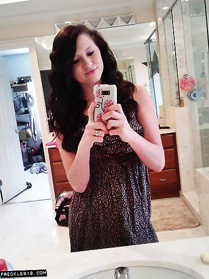 Selfies is what freckles loves to do as she is a hot brunette wh