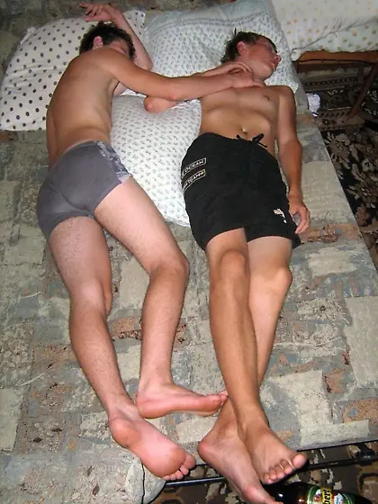 Two boys lying together and about to be used