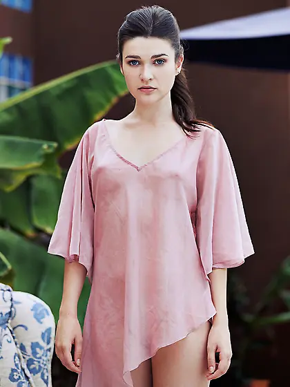 Brunette lady sits couch