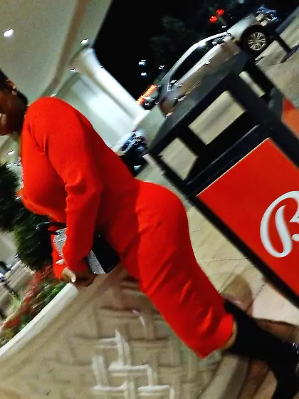 Red dress juicy GILF with phat ass at the casino.