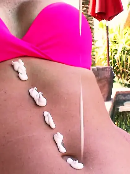 Ponytailed redhead rose bikini