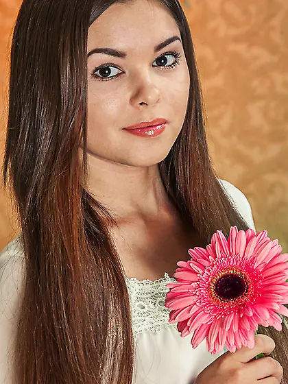 Adorable brown haired girl receives pink...