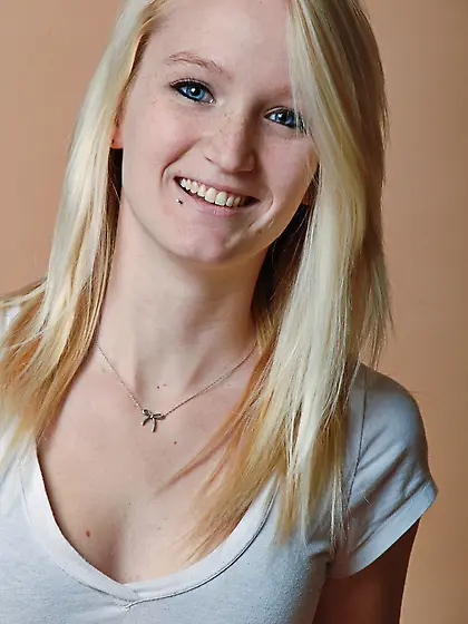 Beauty blonde Emma Morey bending her sexy slender body to get of