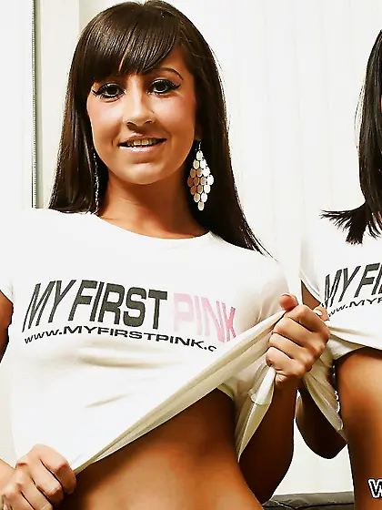 Slender lesbians help each other to undress and play with realis