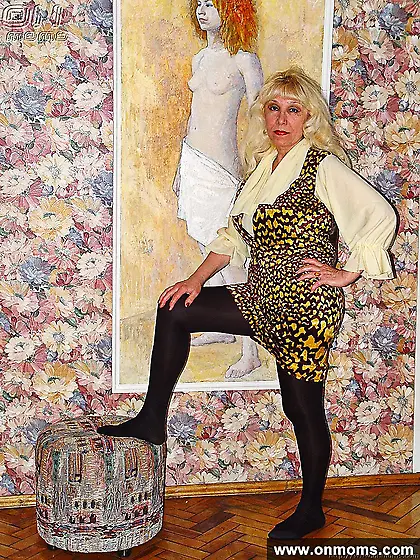 Mature blonde with big tits showing pussy