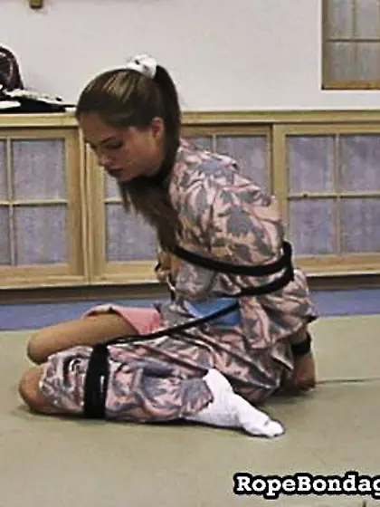 Teenage slutty gal in sexy socks gets tied...