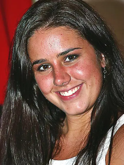 Laughing brunette amateur Kasey Kox removes her skirt,  top and l