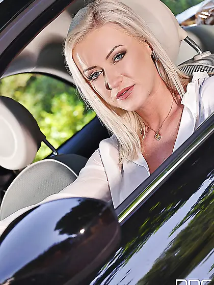 Cute diva got a new car and poses by it as a professional porn m