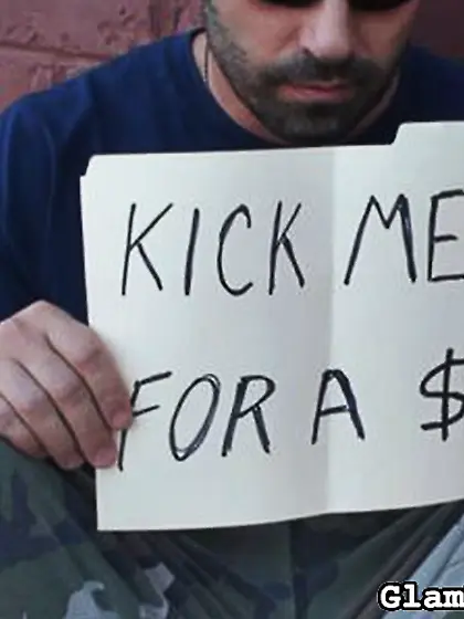 Dude cap kicked street