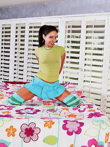 Sexy ass raven babe Trinity St Clair poses on the bed and teases