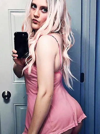 Sexy Femboy in Pink Dress Shows Her Ass