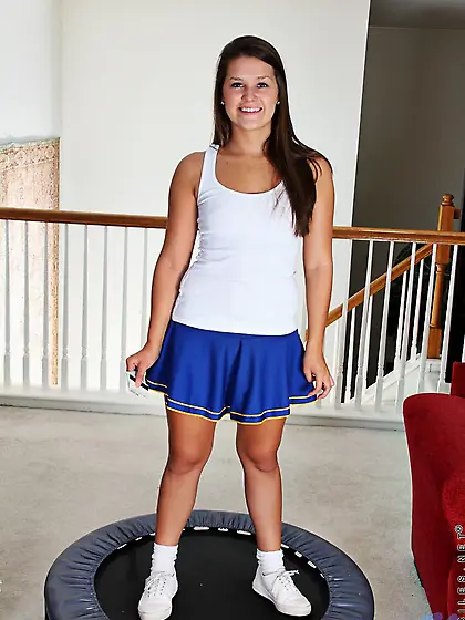 Cute brunette Penny Nubiles shows her flexibility by spreading h