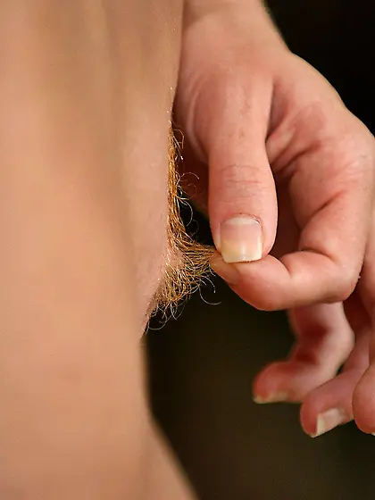 Breathtaking babe pulling out her own pussy hair and masturbatin