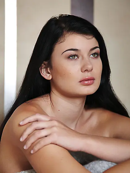 Long-haired brunette sleeps wakes