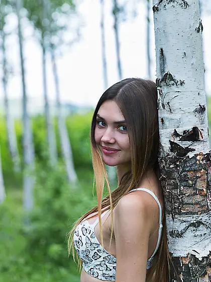 Brown-haired teen baring her beautiful body in the middle of now