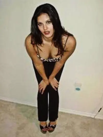 Sunny Leone takes her tight black pants off and teases us with h